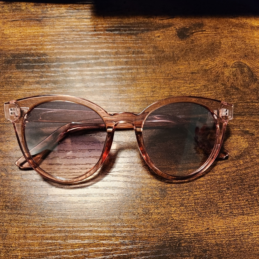 Plastic soft pink sunglasses.